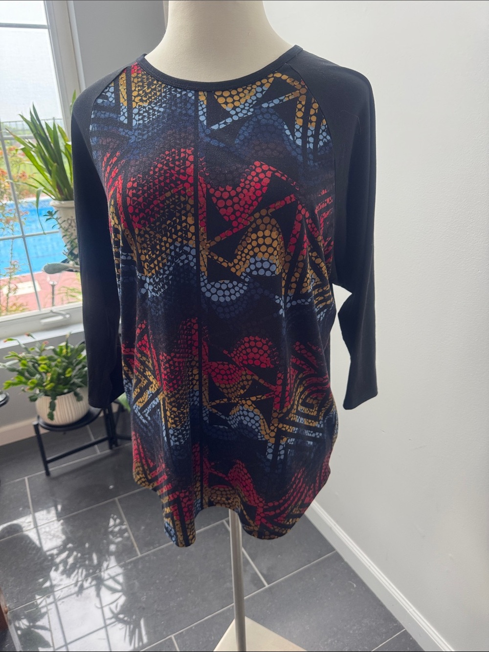 LuLaRoe Black Long Sleeve Top with Red, Gold and Blue Geo Print